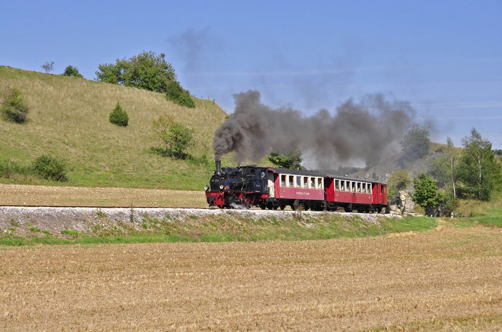 99 7203 Schmalspur Dampflok der Ulmer Eisenbahnfreund ist auf der Strecke Amstetten-Oppingen unterwegs.Ich konnte sie am 9.9.2012 bei der Ausfahrt von Amstetten Bildlich festhalten.