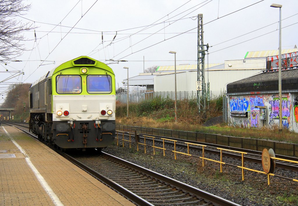 Die Class 66 6605 von Captrain durchfhrt als Lokzug aus Herzogenrath kommend den Bahnhof Kohlscheid in Richtung Aachen-West am 6.1.2012. 