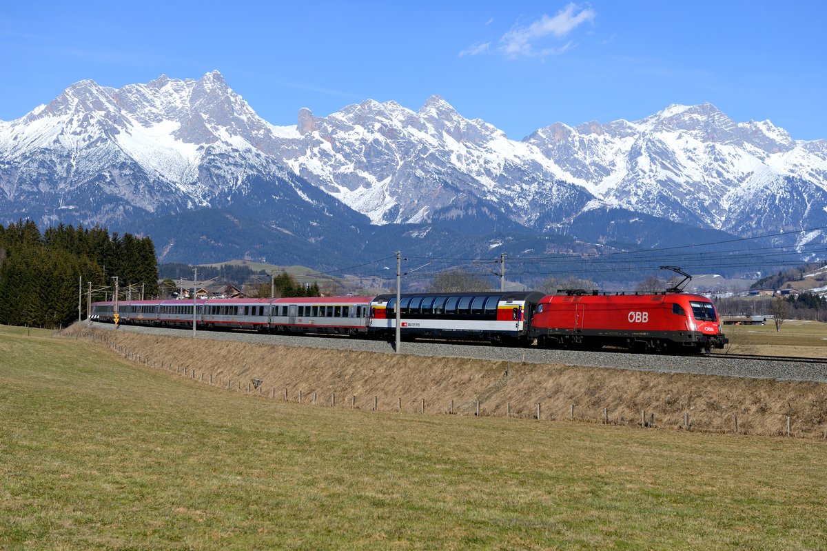 1016.007 mit EC 163  Transalpin  nach Graz HBF bei Gerling im Pinzgau am 19. März 2016.