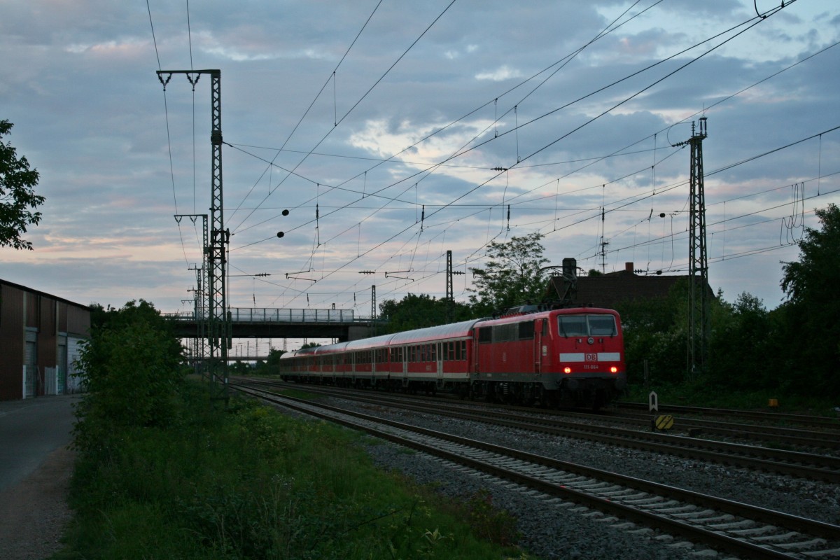 111 064 verlsst mit einer RB nach Offenburg am Abend des 28.05.14 nach dem Halt den Bahnhof Mllheim (Baden).