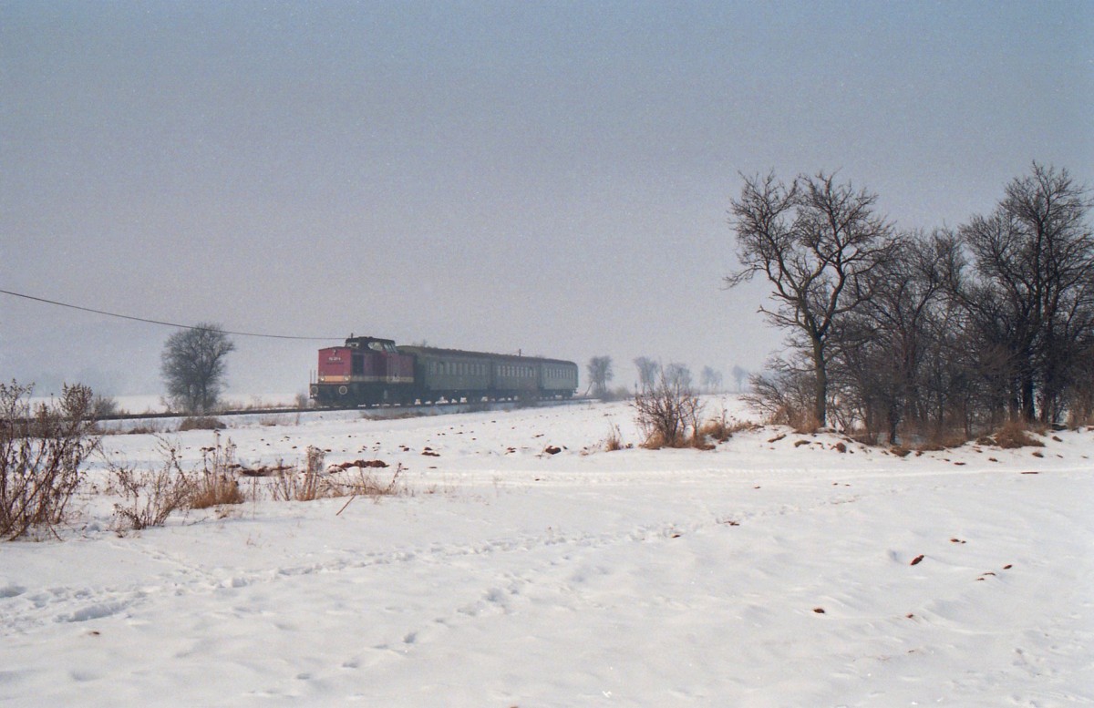 112 321 (Bw Sangerhausen) mit dem N 18509 Stolberg (Harz) - Berga-Kelbra zwischen Uftrungen und Berga-Kelbra (21.02.1991)