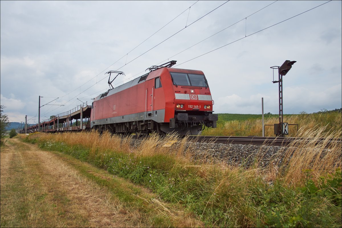 152 149-1 ist bei Dörfle mit einen leeren Autozug am 11.07.2018 unterwegs.
