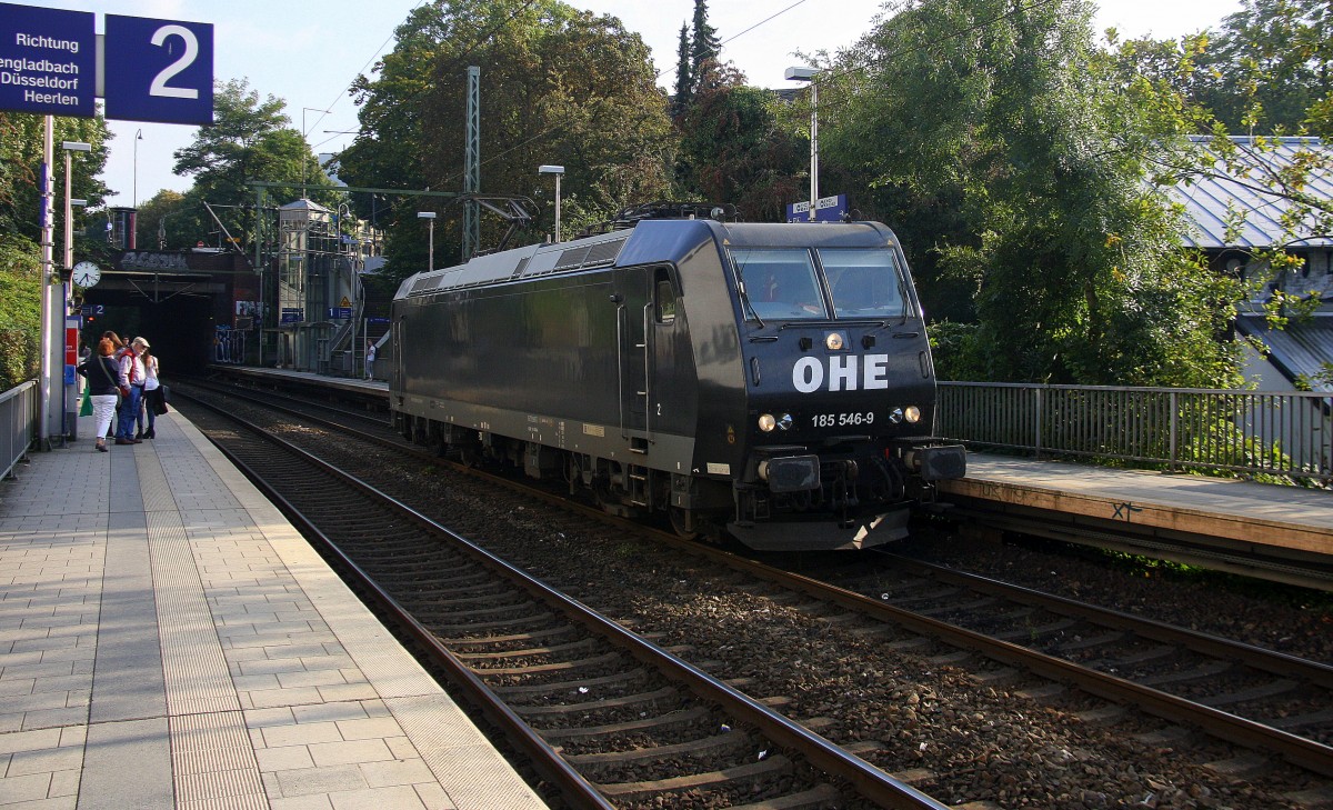 185 546-9 OHE kommt als Lokzug auf dem falschen Gleis aus Richtung Köln,Aachen-Hbf und fährt durch Aachen-Schanz in Richtung Aachen-West bei schönem Sonnenschein am Abend vom 12.9.2014.