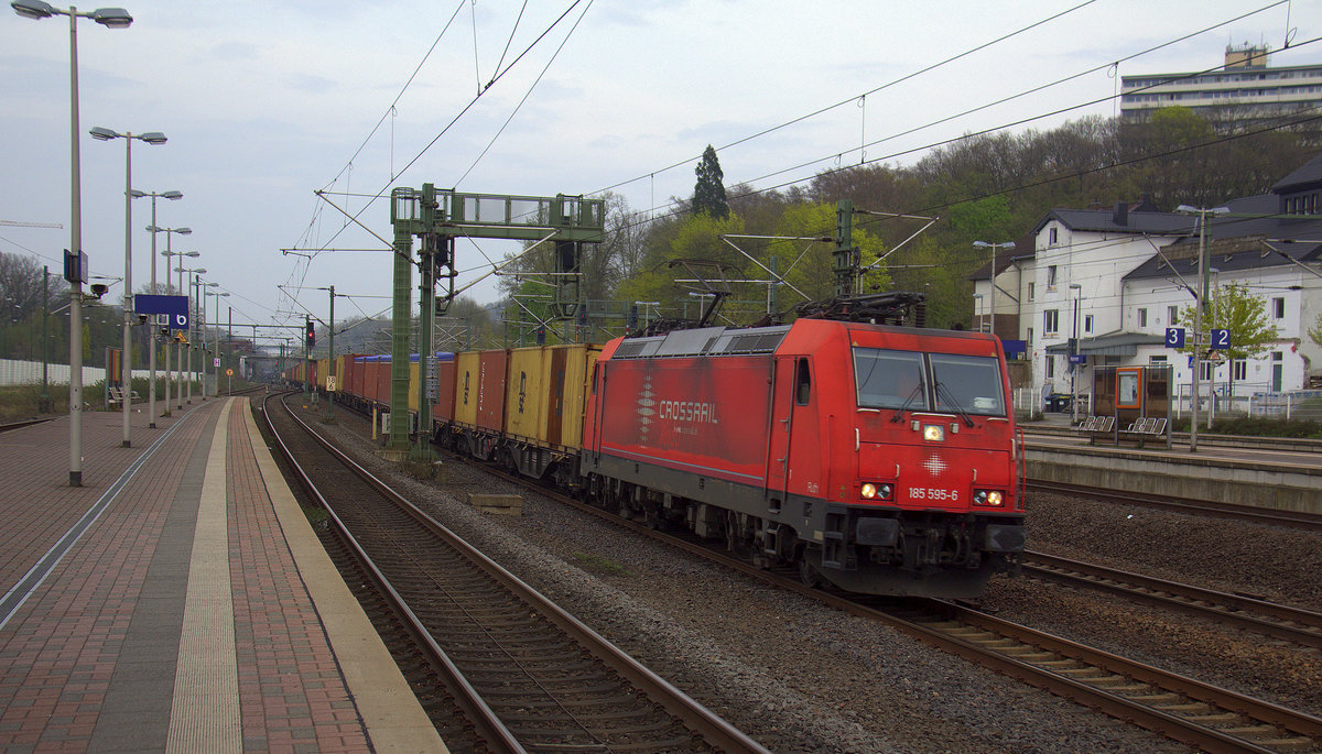 185 595-6  Ruth  von Crossrail kommt mit einem MSC-Containerzug aus Germersheim(D) nach  Antwerpen-Krommenhoek(B) und kommt aus Richtung Köln-Süd,Köln-West,Köln-Ehrenfeld und rast durch Horrem in Richtung Sindorf,Buir,Merzenich,Düren,Langerwehe,Eschweiler-Hbf,Stolberg-Hbf(Rheinland),Aachen-Eilendorf,Aachen-Rothe-Erde,Aachen-Hbf,Aachen-Schanz,Aachen-West.
Aufgenommen vom Bahnsteig 6 in Horrem.
Am Abend vom 14.4.2018.