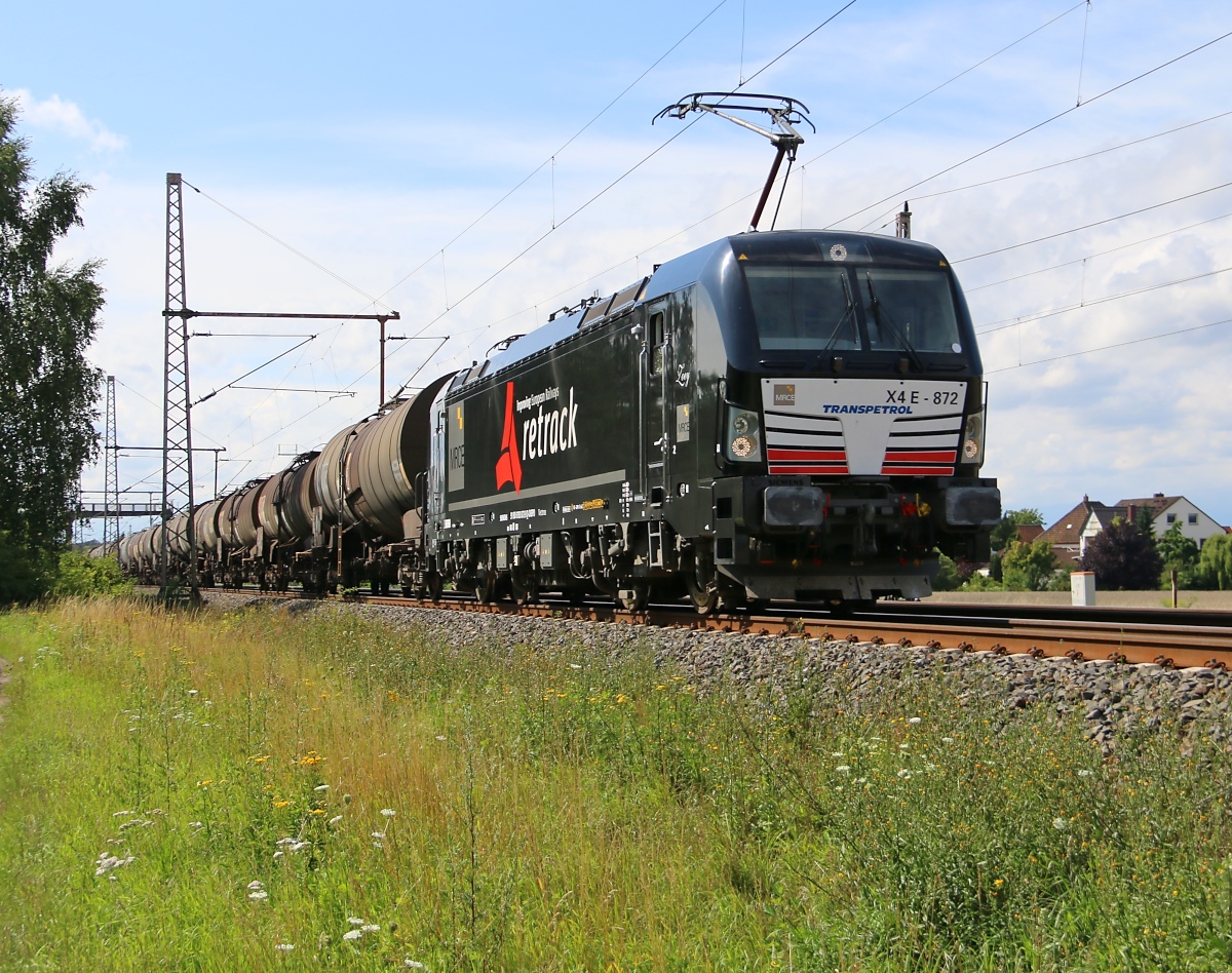 193 872 mit Kesselwagenzug in Fahrtrichtung Seelze. Aufgenommen am 29.07.2015 in Dedensen-Gümmer.