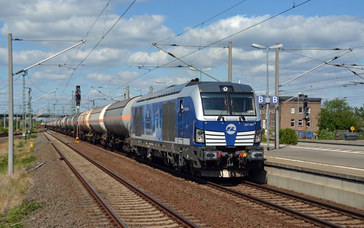 247 907 der Infra Leuna führte am 05.08.18 den sonntäglichen Ammoniakzug von Wittenberg-Piesteritz nach Großkorbetha. Hier führt sie ihren Zug durch Bitterfeld Richtung Leipzig.