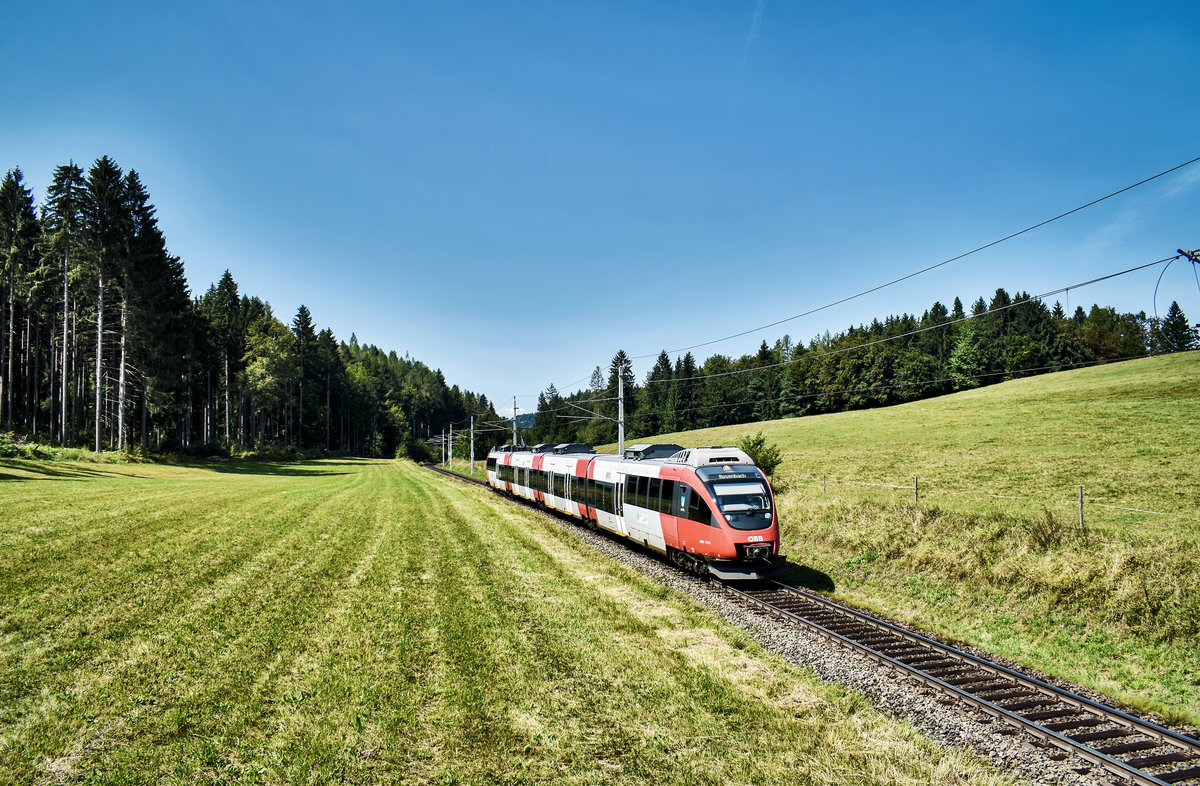 4024 117-6 fährt als S2 4971 (Villach Hbf - Rosenbach), bei Schlatten, nahe Rosenbach vorüber.
Aufgenommen am 28.8.2018.
