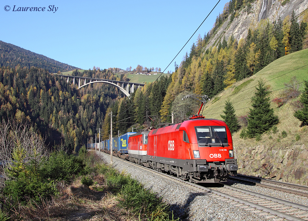 A pair of OBB locomotives approach Sanktt Jodok whilst working a southbound freight train, 8 November 2013. The lead locomotive is 1116 180 the second locomotive is a class 1144.