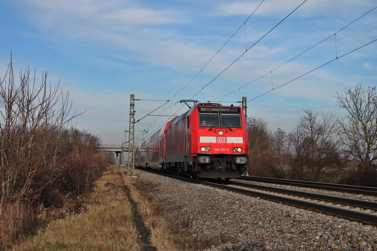 Am 18.01.2014 bespannte die Freiburger 146 231-6 einen RE von Offenburg nach Basel Bad Bf, als sie südlich vom Hp Buggingen ihrem nächsten Halt in Müllheim (Baden) entgegen fuhr.