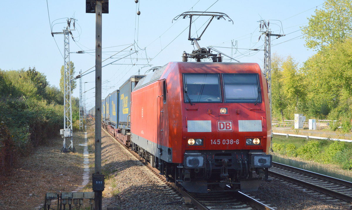 DB Cargo Deutschland AG mit  145 038-6  [NVR-Number: 91 80 6145 038-6 D-DB] und KLV-Zug (LKW-WALTER Trailer) am 19.09.18 Bf. Berlin-Hohenschönhausen.