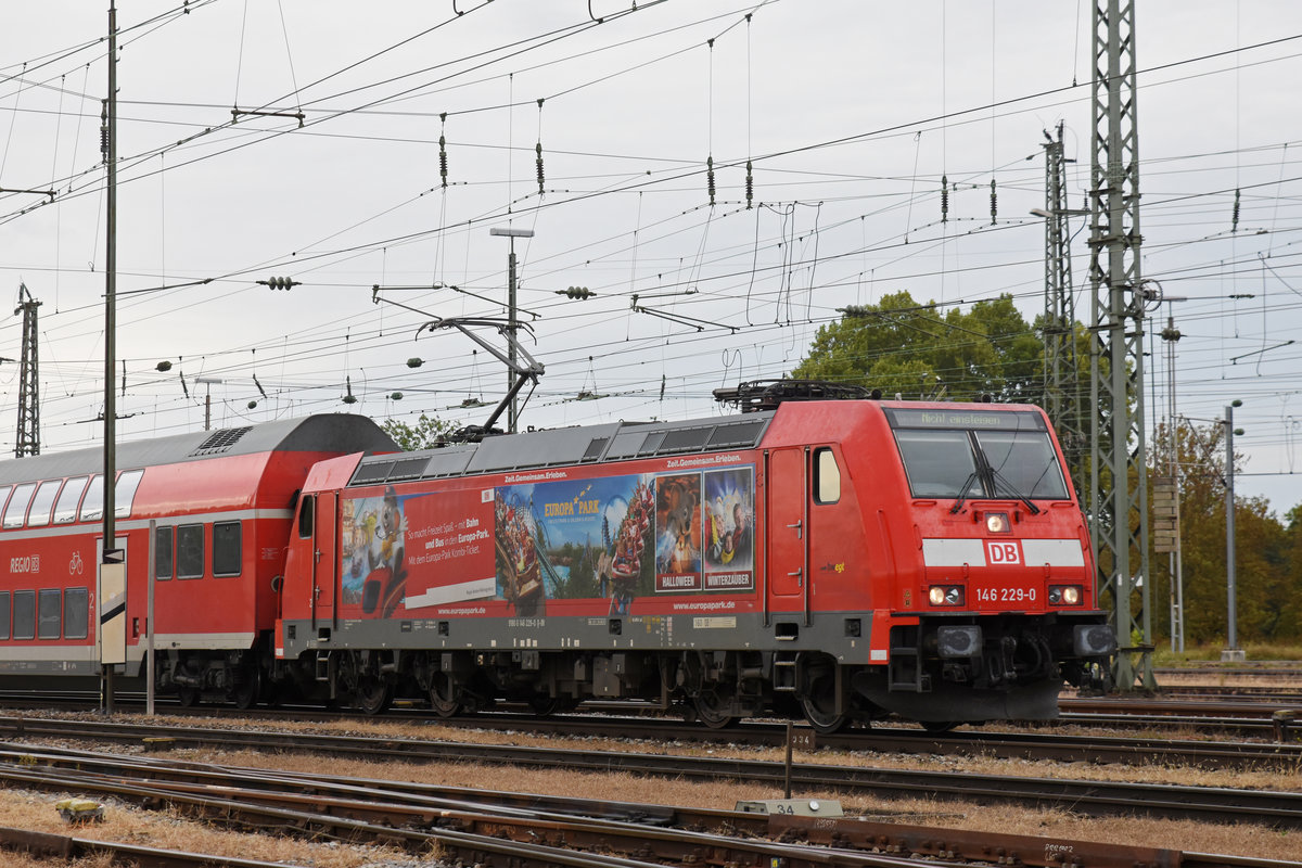 DB Lok 146 229-0 fährt beim badischen Bahnhof ein. Die Aufnahme stammt vom 21.09.2018.