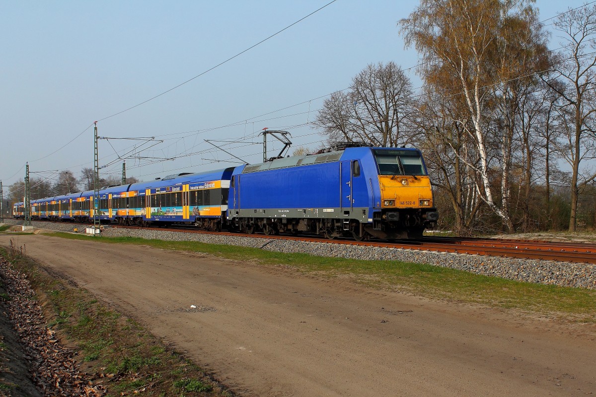 Die 146 522-8 mit dem X 68904 von Warnemünde nach Leipzig Hbf mit dem NOB Werbezug am 03.04.2014 in Nassenheide.