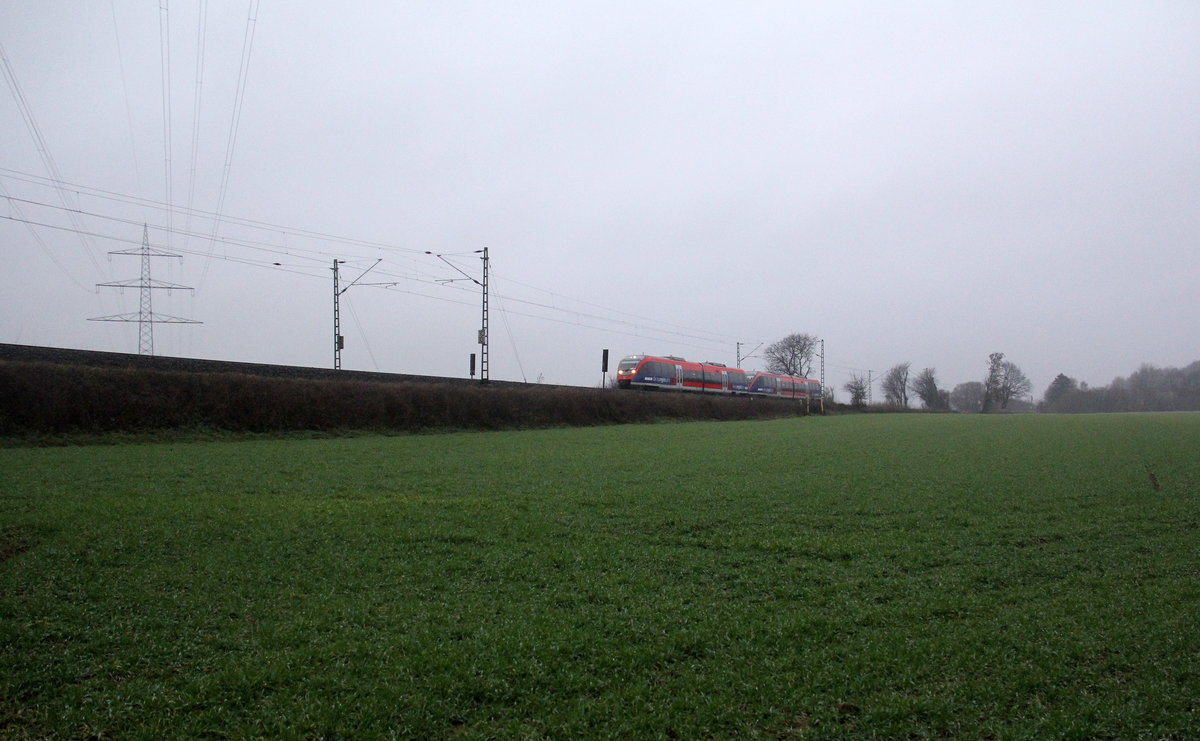 Die Euregiobahn RB20 Richtung Aachen unterwegs zwischen Kohlscheid und Richterich.
Aufgenommen zwischen Aachen und Kohlscheid in Uersfeld,Richterich. 
Bei Regenwetter am Kalten Nachmittag vom 7.1.2019.