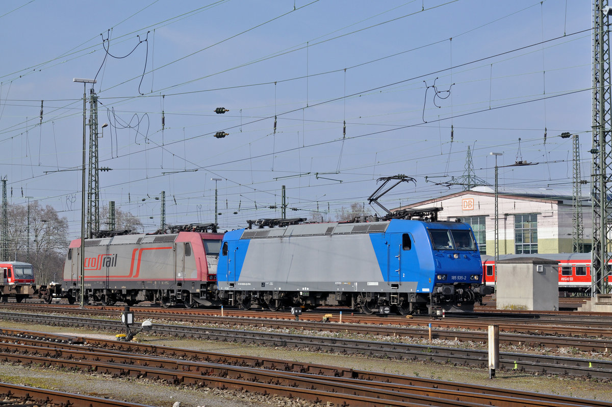 Doppeltraktion, mit den Lok's 185 535-2 und 185 601-2 durchfahren den Badischen Bahnhof. Die Aufnahme stammt vom 24.03.2016.