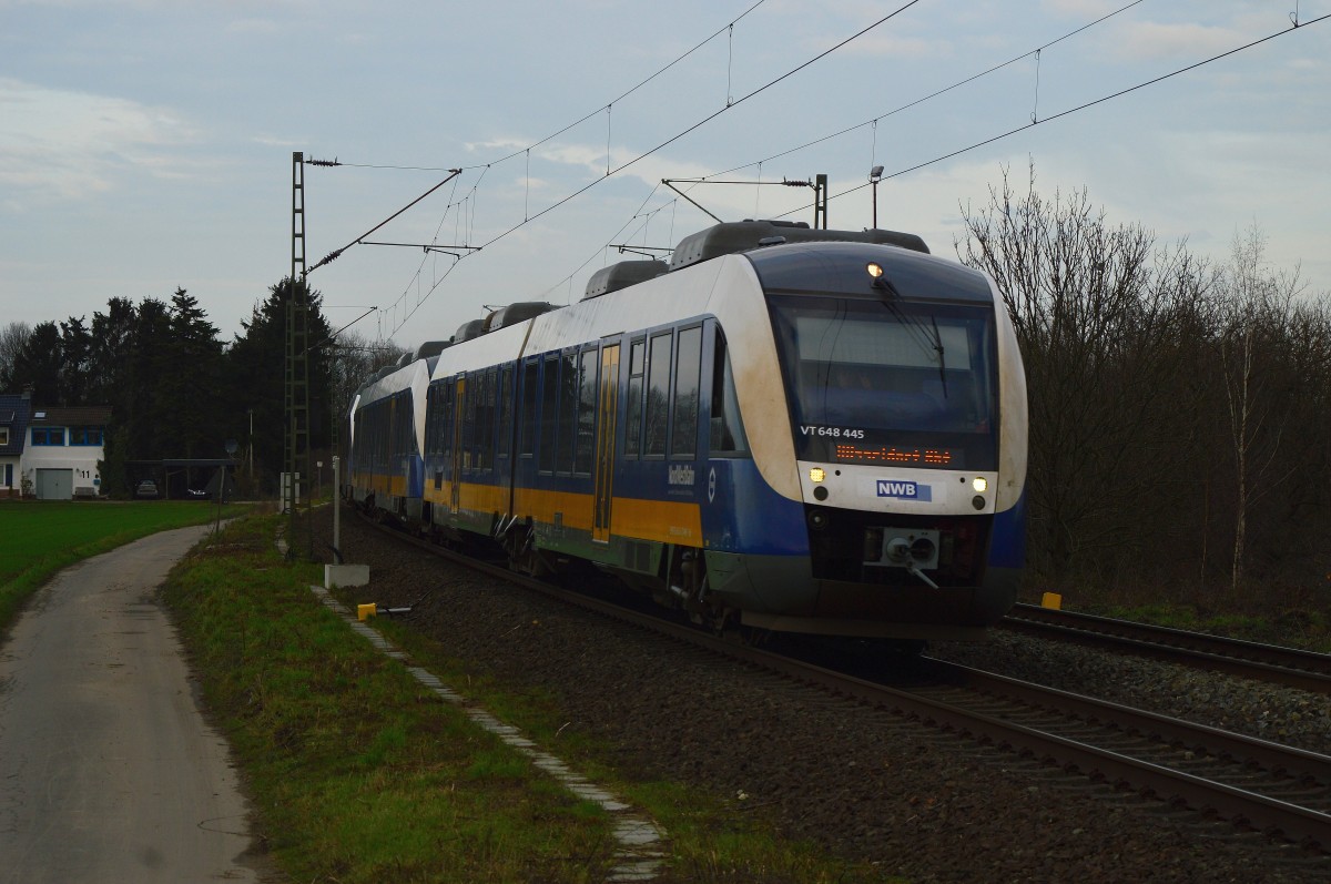 Ein vom NWB 648 445 geführter RE10 ist hier am ADAC Verkehrsübungsplatz auf seinem Weg nach Düsseldorf am Samstag den 19.12.2015