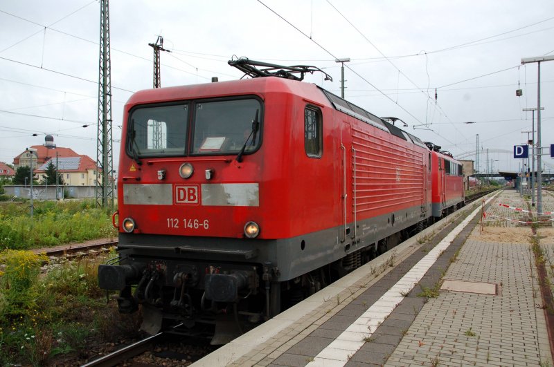 112 146 stands together with 111 159 in Dessau Hbf.