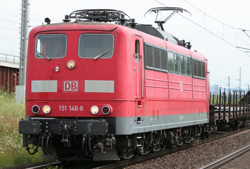And a mixed freight train pulls 151146-8 through Cologne Porz