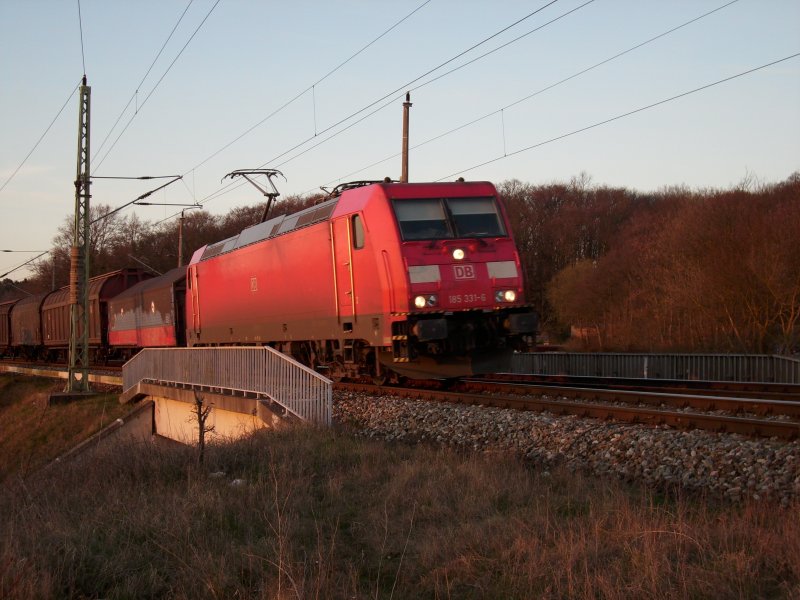 185 331 on Apr 10, 2009 with a freight train