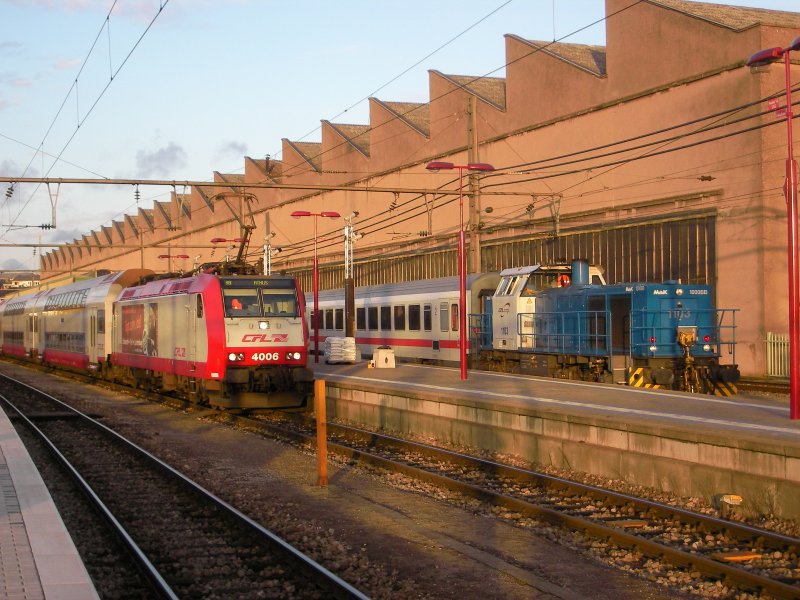 Electric locomotive 4006 with train at the station is provided
