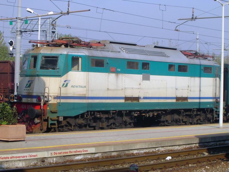 E 424 is waiting in front of a local train