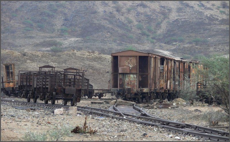 The parking area from May Atal, with dozens of rusty