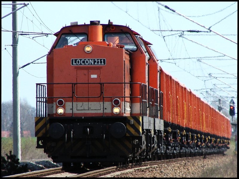 Locon 211 and 212 ride in the midday heat of