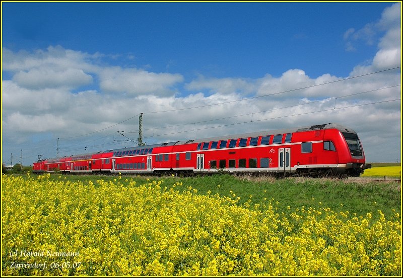 114011-0 RE38317 slides the buttercup-colored boxes of Stralsund to Falkenberg