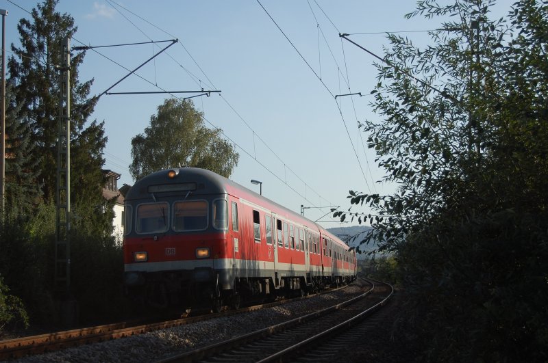 A regional train-set, pushed by 110494-2 and led by a