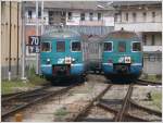 ale-801--940 Zwei betagte Triebz�ge ALe 803 treffen sich in Tirano. Der linke R5202 trifft soeben aus Sondrio ein. (08.05.2010)