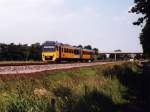 3231 mit Regionalzug 30260 Groningen-Leeuwarden bei Kollumerzwaag am 19-6-1999. Bild ...