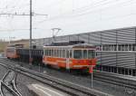 ASm Aare Seeland Mobil asm BTI - Kieszug mit Be 4/4 101 3 mit Kieswagen Typ Fa und Be 4/4 523 in Siselen am 21.02.2010