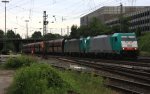 Zwei Cobra 2834 und 2820 kommen mit einem langen Kalkzug aus Yves-Gomeze(B) nach Millingen und fahren in Aachen-West ein in der Abendstimmung am Abend vom 2.7.2013.