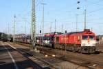 Die Class 66 DE6310  Griet  von Crossrail steht in Aachen-West mit einem sehr langen Fiat-Autozug aus Tychy(PL) nach Zeebrugge(B) und wartet auf die Abfahrt nach Belgien. Aufgenommen vom Bahnsteig in Aachen-West bei schönem Sonnenschein  am 2.2.2014.