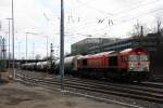 Die Class 66 DE6312  Alix  von Crossrail kommt aus Richtung Montzen/Belgien mit einem Kurzen Silozug aus Herentals(B) nach Buna-Werke(D) und fährt in Aachen-West ein bei Sonne und Regenwolken am Nachmittag vom 16.2.2014.