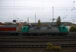 Die Cobra 2841 fährt mit einem langen Arcese-LKW-Zug aus Verona(I) nach Zeebrugge(B) bei der Ausfahrt in Aachen-West und fährt in Richtung Montzen/Belgien. Aufgenommen vom Bahnsteig in Aachen-West bei Regenwolken am 25.10.2014.