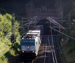 Die Cobra 2838  kommt aus dem Gemmenicher-Tunnel raus mit einem Containerzug aus Antwerpen-Oorderen(B) nach Gallarate(I)  und fährt nach Aachen-West und rollt die Gemmenicher-Rampe herunter nach Aachen-West. 
Aufgenommen in Reinartzkehl auf der Montzenroute. 
Bei Sommerwetter am Abend vom 14.7.2016. 