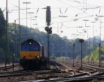 Die Class 66 DE6306 von DLC Railways fhrt mit einem Containerzug  aus Novara(I) nach Genk-Zuid-Haven(B) bei der Ausfahrt aus Aachen-West und fhrt in Richtung Montzen(B)  bei Sonnenschein am 22.7.2012.