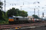 Die Class 66 DE6307 von DLC Railways fhrt mit viel Gas mit einem sehr langen Containerzug aus Ludwigshafen-BASF nach Zeebrugge-Ramskapelle(B) bei der Ausfahrt aus Aachen-West und fhrt in Richtung Montzen/Belgien bei Regenwolken in der Abendstimmung am 14.9.2013. 