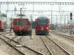 Mittagsruhe im Depot Landquart,zwei Triebzug Generationen der RhB einträchtig nebeneinander.Landquart ... Mittagsruhe im Depot Landquart,zwei Triebzug Generationen der RhB einträchtig nebeneinander.Landquart ...