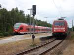BR 101 mit Zugen Bevor IC 2212 aus Koblenz Binz erreichte,mu�te Dieser im Kreuzungsbahnhof Prora auf den Flirt 429 026,aus Binz warten,bevor es f�r den IC weiter auf der eingleisigen Strecke nach Binz ging.Aufnahme vom 24.Juli 2010.