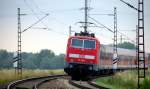 BR 111 mit Zugen 111 218 am Morgen des 05.07.2010 kurz vor Plattling.