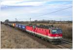 1144.266 & 1144.031 mit einem Containerzug bei Gramatneusiedl; 28.2.2010.  ...