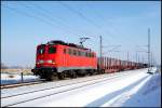 BR 140 mit Zugen 140 850-9 durchf�hrt mit dem 53202 von Sassnitz-Mukran nach Rostock-Seehafen am 23.01.2010 die Ausweichstelle Langendorf.