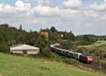 145 067-5 mit Containern am 19. August 2010 bei Elze. ...