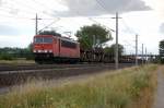 BR 155 155 055-7 mit einem leeren Autotransportzug zwischen Gro�wudicke und Rathenow in Richtung Wustermark. 26.07.2010