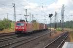 BR 185 mit Zugen 185 169-0 mit einem Containerzug am 25.07.2010 durch Buchholz(Nordheide) gen Maschen Rbf