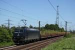 br-185-mrce 185 547 mit einem Holzzug am 3.6.10 in Ahlten.