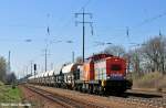 hvle V160.1 brummt mit ihrem kurzen Schotterzug gem�tlich der Baustelle ...