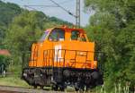BR 214 214 009-3 rauschte am 07.07.2010 Lz in Richtung Bebra durch die lange Kurve bei Mecklar.