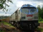 OHE 330091 wartet am 19.06.2010 auf die Beladung eines Holzzuges ...